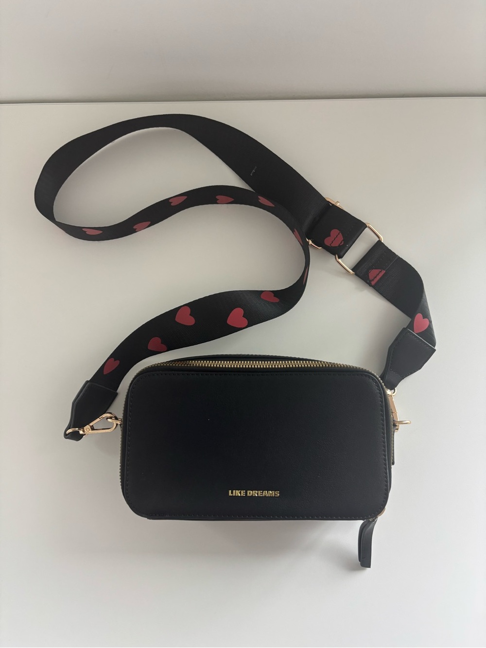 LIKE DREAMS Black Crossbody Bag with Heart-Print Strap